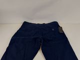 a pair of blue shorts with a tag on the side