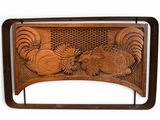 an image of a wooden headboard with a carved design on it