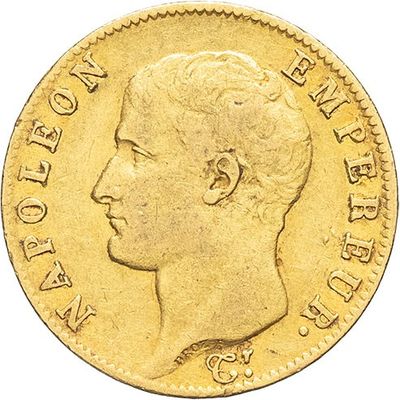 a gold sovereign coin with a profile of a man ' s head