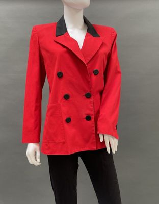 a mannequin wearing a red jacket and black pants