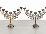 pair of antique brass candelabs on cast iron bases