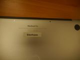 a close up of a laptop computer with a sticker on it