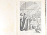un livre ouvert sur lequel figure le dessin d'un homme en robe et d'une femme en robe