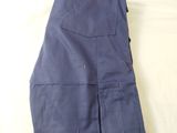 a pair of blue pants laying on a bed
