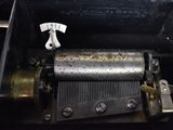 a music box that has a clock inside of it