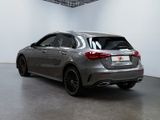 the rear end of a silver mercedes cla parked in a white room