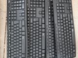 four keyboards sitting on the ground next to each other