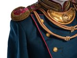 the uniform of a man in a military uniform is blue and gold