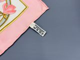 a pink scarf with a picture of a rose on it