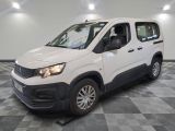 the white van is parked on a checkered floor in a room