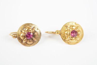 an image of a pair of gold earrings with pink stones