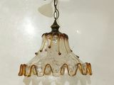 a light that is hanging from the ceiling in the room
