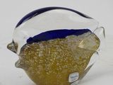 a glass fish that is sitting on a table