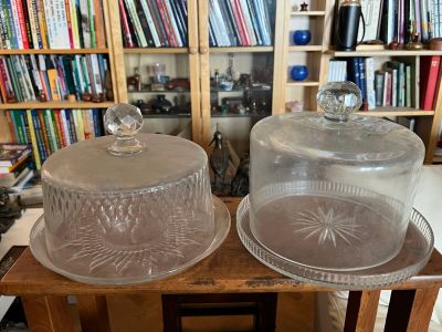 two clear glass dishes on a wooden table