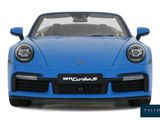 the front view of a blue sports car on a white background