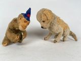 two stuffed animals that are sitting next to each other
