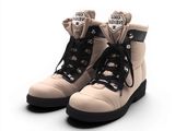 une paire de bottes posées sur une surface blanche