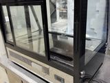 an image of a glass display case in a warehouse