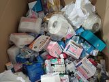 a cardboard box full of toilet paper and other items