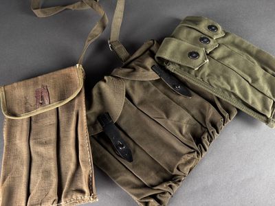 two pieces of military clothing sitting on top of a table