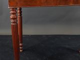 a wooden table with a clock on top of it
