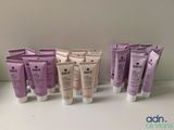 several tubes of skin care products are lined up on a table