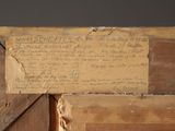 a piece of wood with writing on it and a piece of wood with writing on it