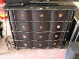 an image of a black dresser with a laptop on top of it