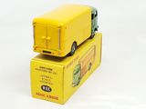 a yellow toy truck sitting on top of a yellow box