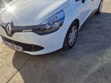 a white car parked in a parking lot next to other cars