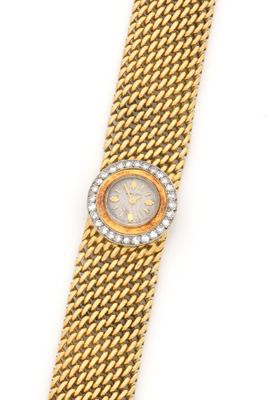 a lady ' s gold and diamond wrist watch
