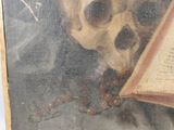 a painting of a skull reading a book with a chain around its neck