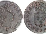 a close up of a coin with a crown on it