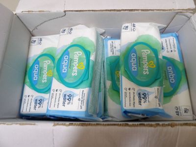 two packages of soap sitting in a box on a table