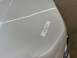 a sticker on the hood of a white car