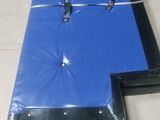 two pieces of blue plastic on the floor next to each other