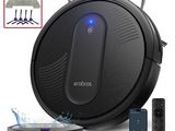 an image of a robotic vacuum cleaner with a remote control