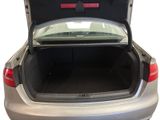 a trunk of a silver car with its trunk open