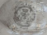 a close up of a plate with a seal on it