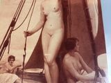 a picture of a nude woman standing on a boat