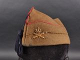 a brown hat with a skull and crossbone on it