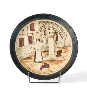 a plate with a picture of a woman and a dog