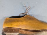 a wooden shoe that has been placed on top of a table