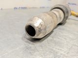 a metal pipe that is sitting on a table