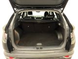 the back of a car with the trunk open and the back seats down