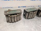 a pair of old batteries sitting on top of a table