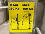 a yellow sticker on the side of a metal pole