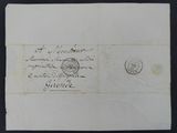 an old envelope with a stamp on it sitting on top of a table