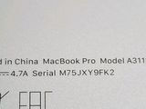 a close up of the back of an apple macbook pro