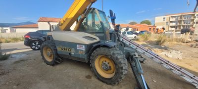 a construction vehicle that is parked on the side of the road